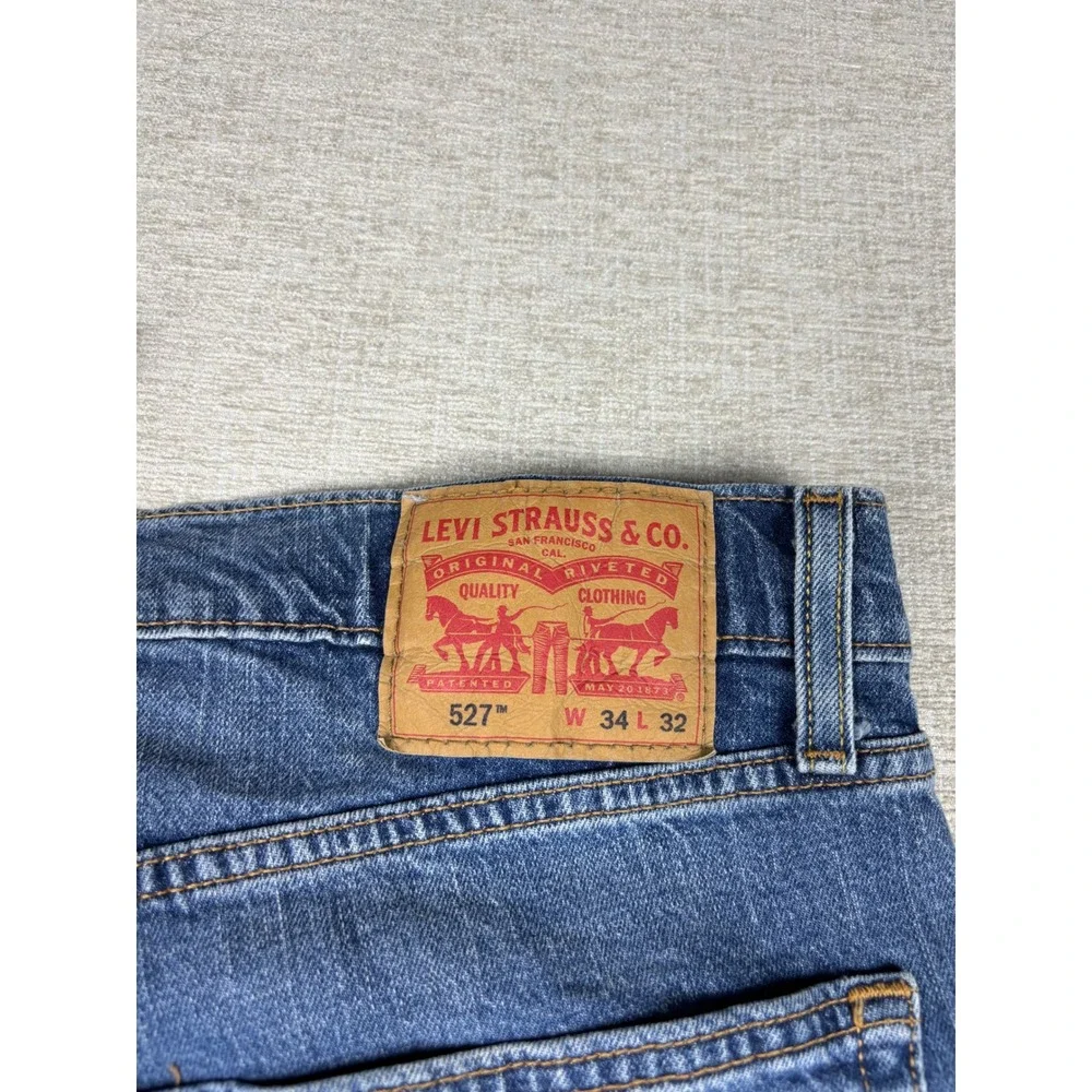 Levis 527  Bootcut  Mens 34x32 Jeans Grungy Medium Wash Blue Denim Fading
